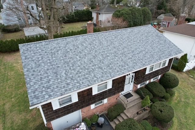 Aerial view of a gray roof on a ranch home