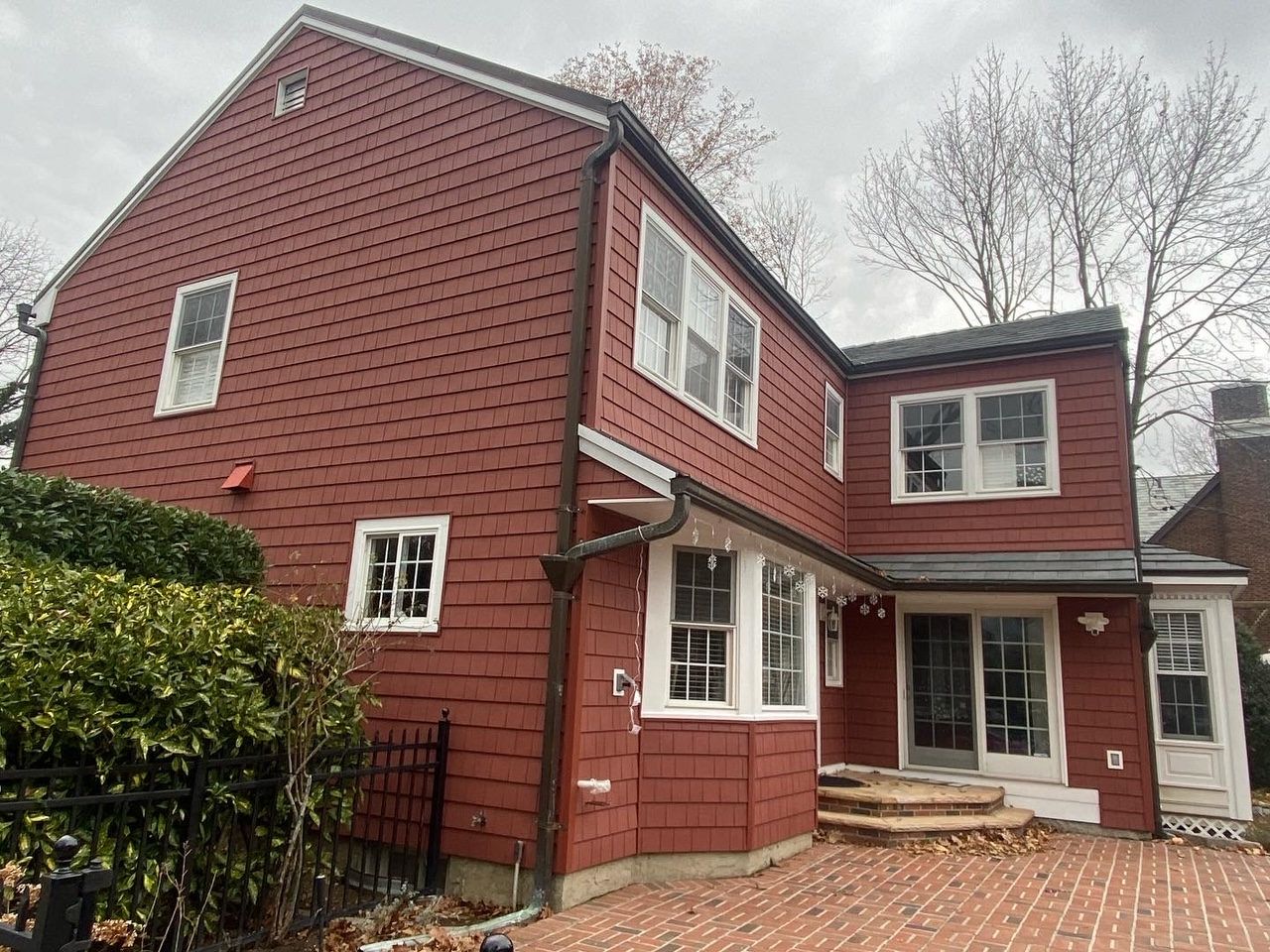 Red siding on a two-story house